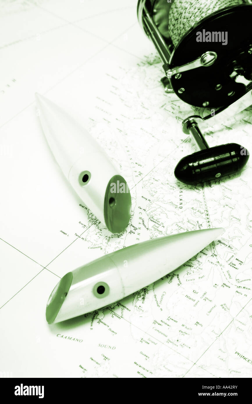 Sportfishing concept image of fishing plugs and reel on map of British