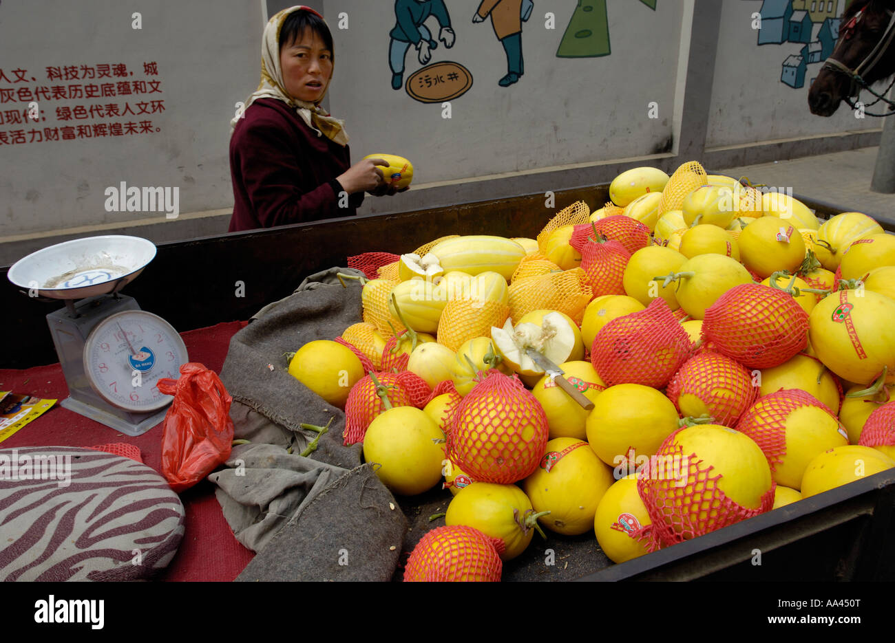 Chinese farmer vendors sell local fruits on a street of Beijing China Apri 21 2006 Stock Photo