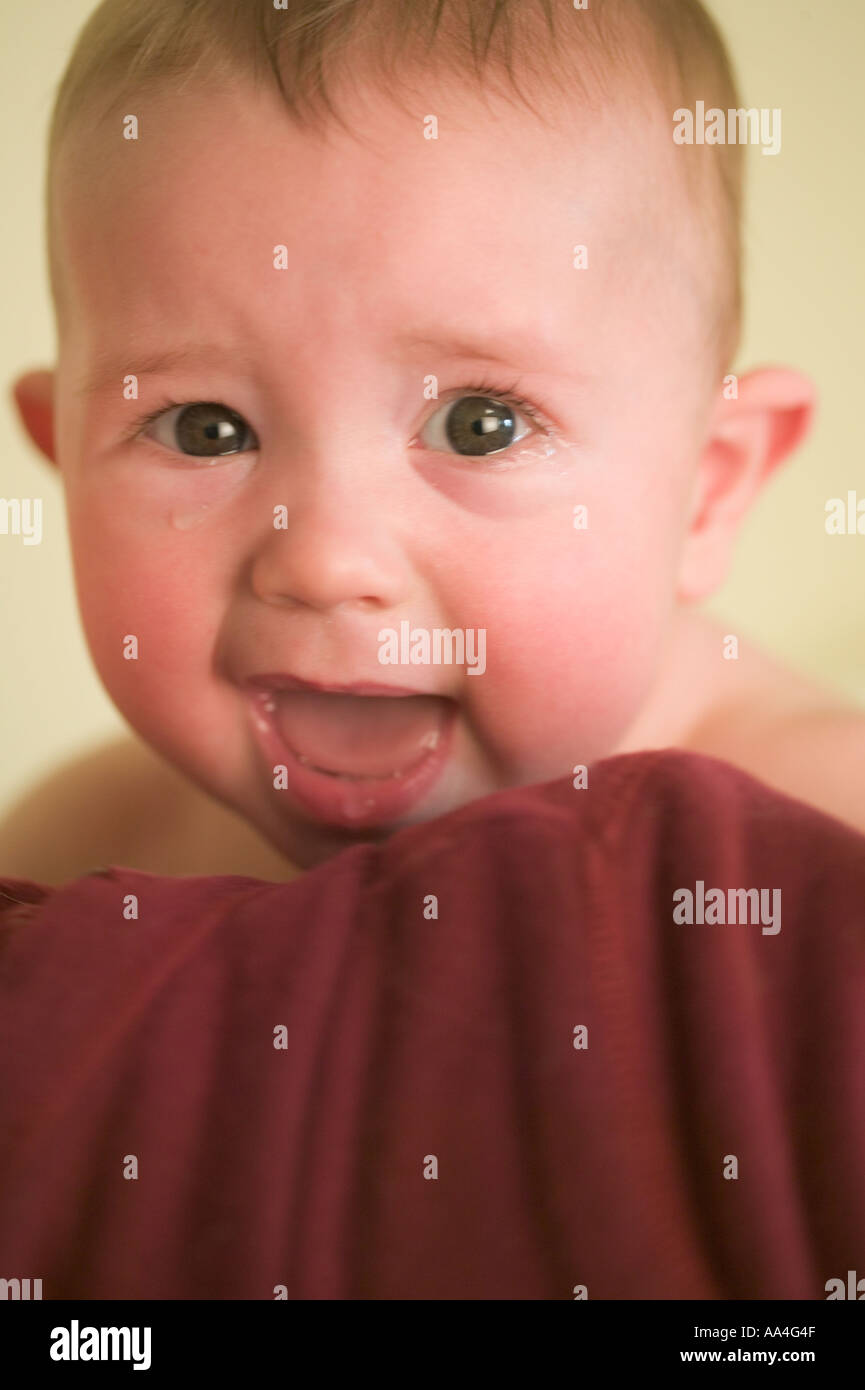 6 Month Old Boy Crying On Mothers Shoulder Stock Photo Alamy
