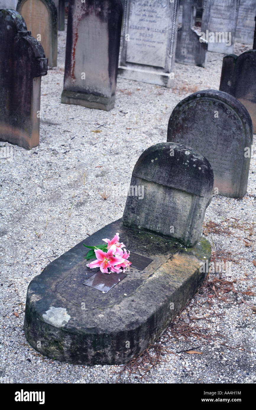 Child's grave with flowers Stock Photo