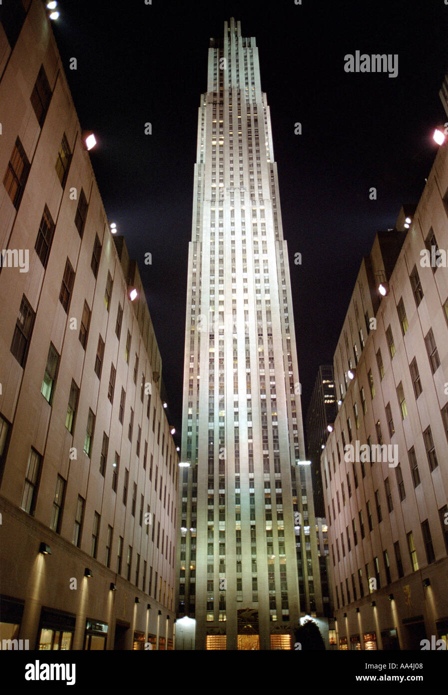 View looking up at the GE Building at Rockefeller Plaza Illuminated at Night Stock Photo