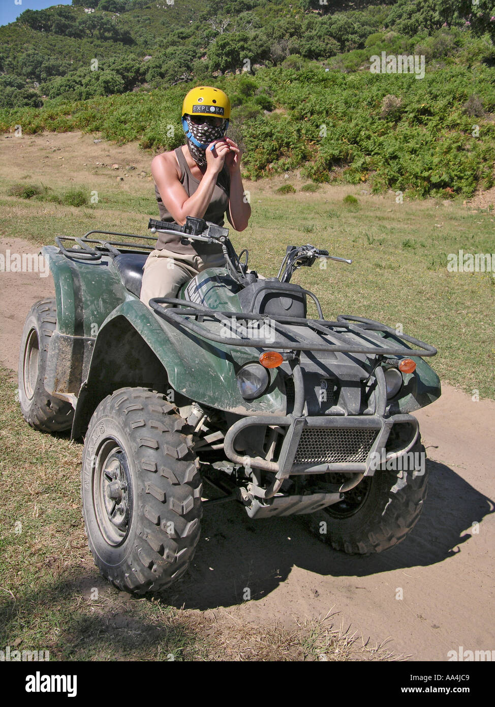 Female Quad Rider Securing Safety Helmet Stock Photo Alamy