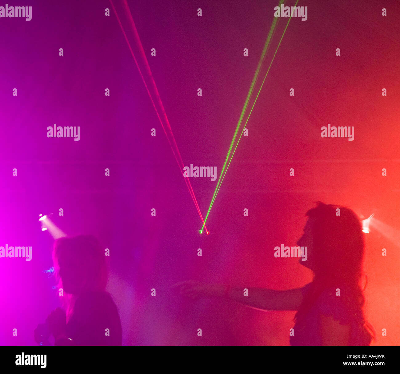 Two women dancing in a nightclub Stock Photo