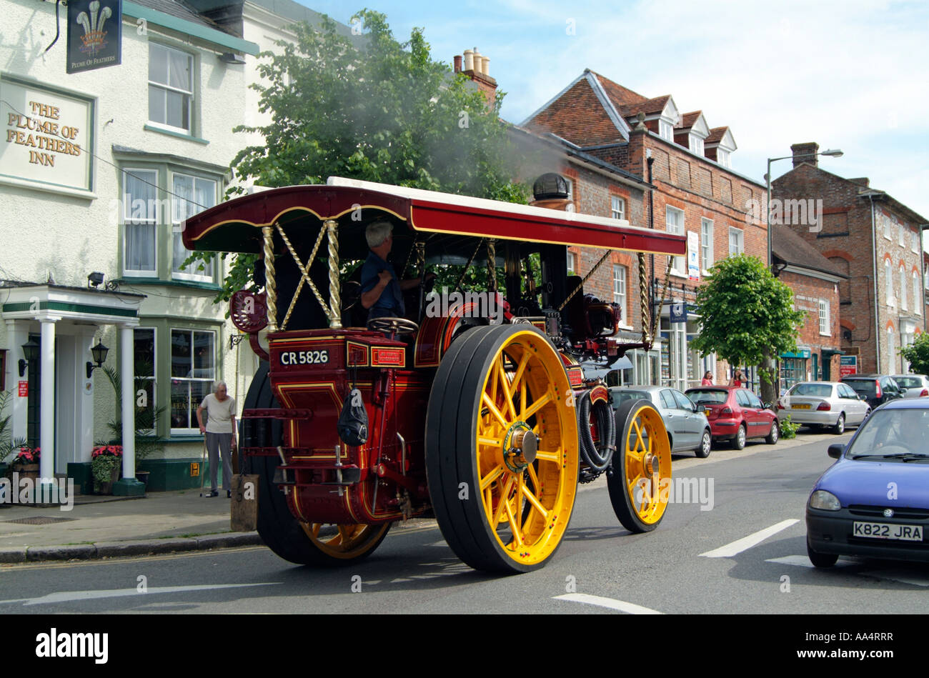 Steam traction engine on the main street in Hungerford Berkshire England UK Passing the Plume of Feathers Inn Stock Photo