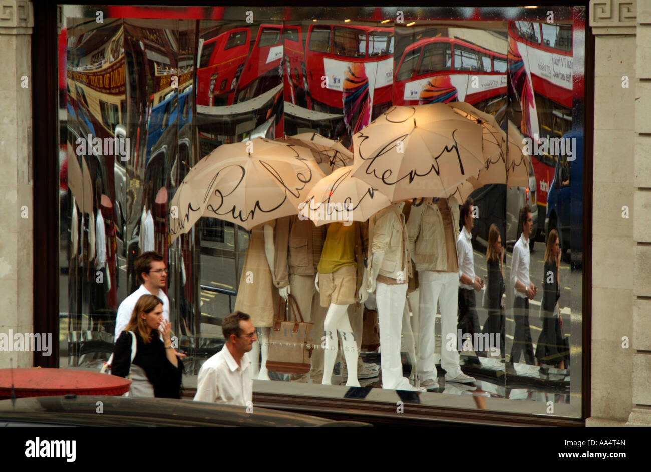 Burberry shop window relections of red London buses Regent Street London  England UK Stock Photo - Alamy