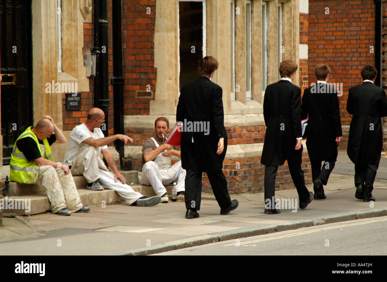 Eton College. Painters take a break and pupils walk past. England UK Stock Photo