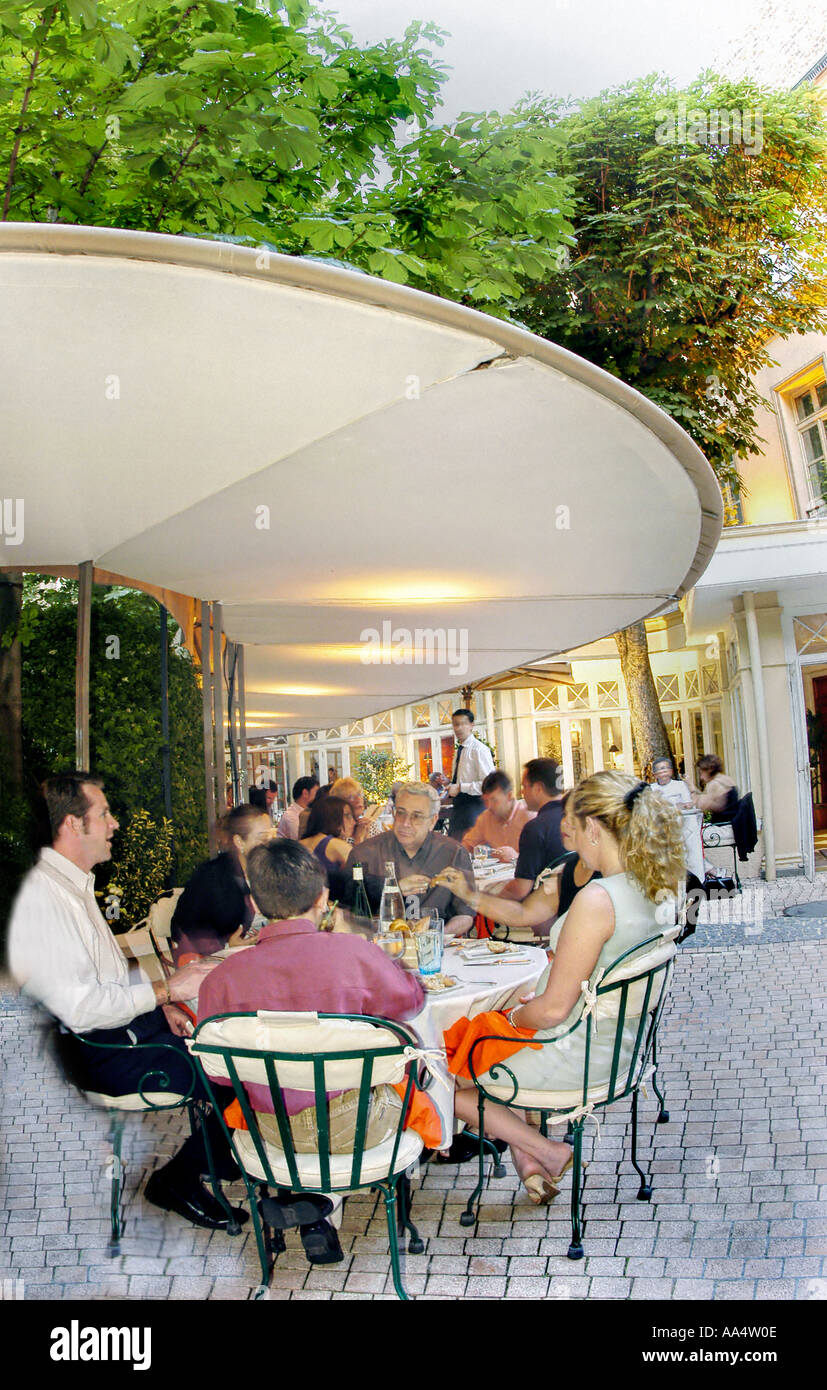 Paris France, Family Dining in 'La Terrasse du Parc'  Contemporary French Restaurant Terrace at the 'Parc Sofitel Hotel' Stock Photo