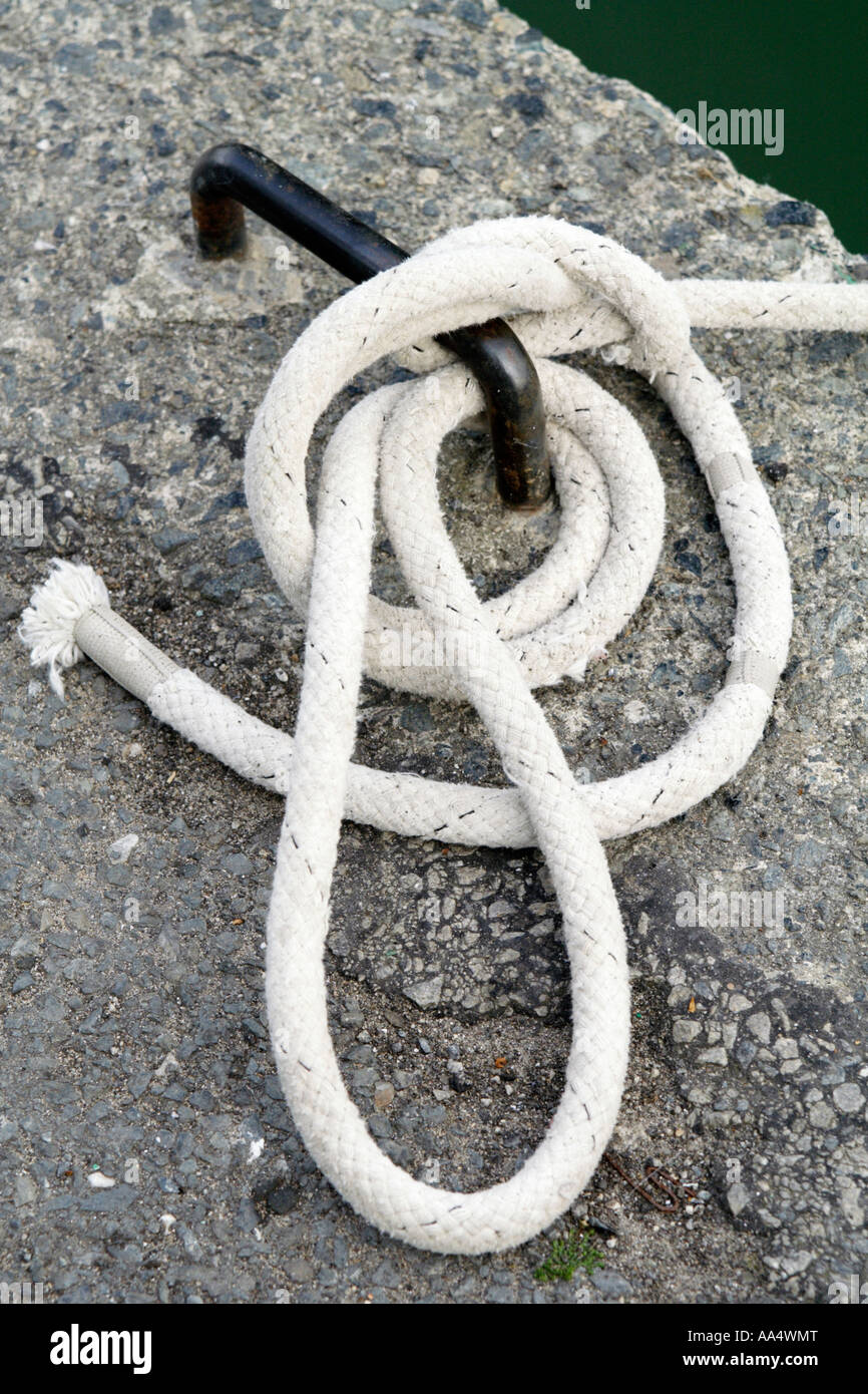 Rope wound round a mooring ring, UK Stock Photo - Alamy