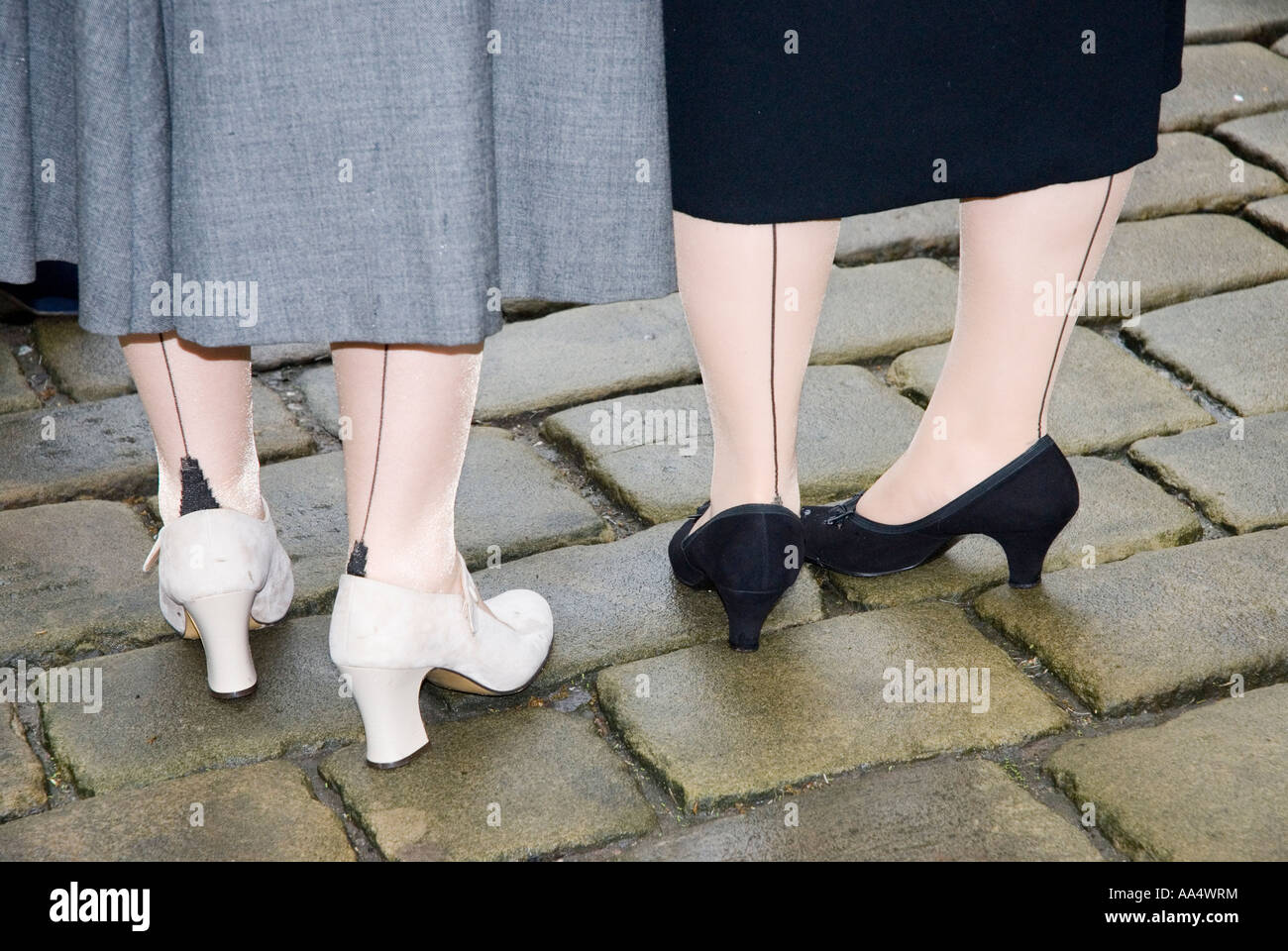 Women wearing stockings with seams at a 1940 s WW2 re enactment weekend Haworth West Yorkshire Stock Photo