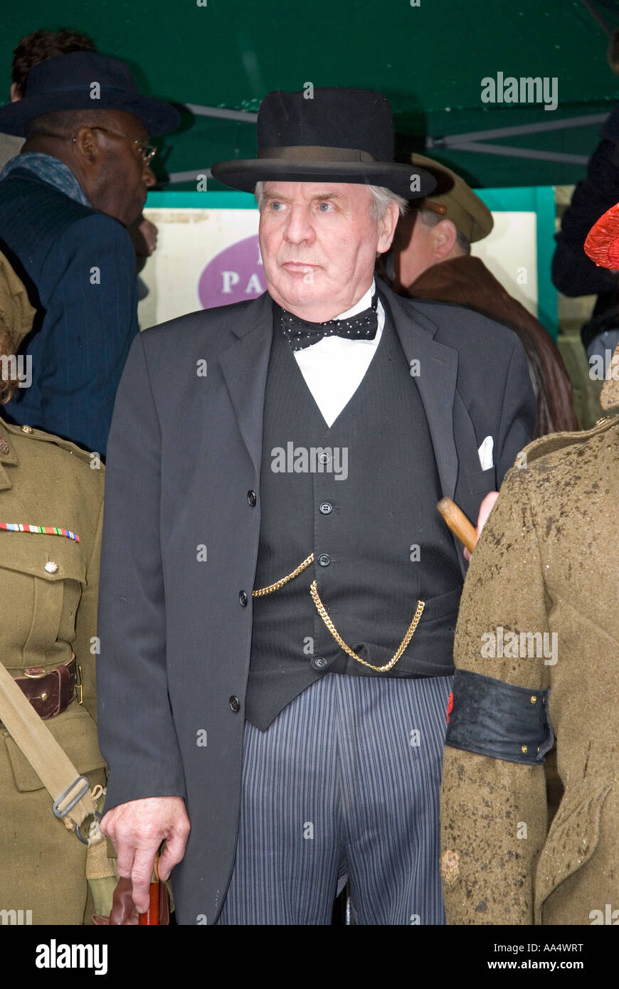 A Winston Churchill impersonator at a rainy 1940 s WW2 re enactment weekend Haworth West Yorkshire Stock Photo