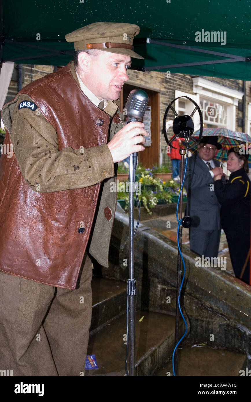 A crooner at a rainy 1940 s WW2 re enactment weekend Haworth West Yorkshire Stock Photo