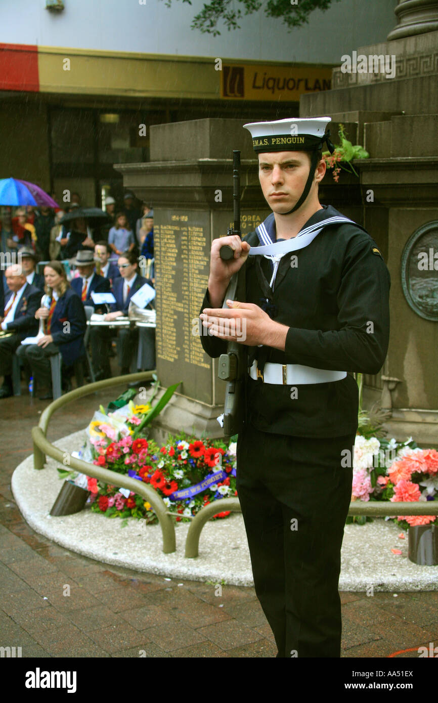 A young sailor presents arms during an ANZAC day ceremony at the war memorial in Manly Australia Stock Photo