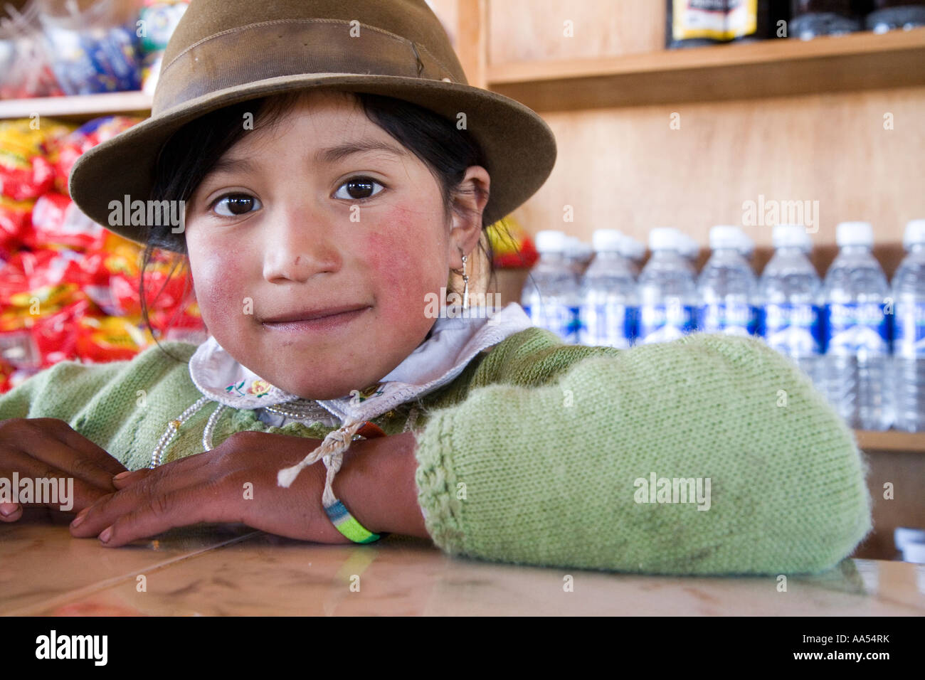 An ecuadorian girl over the shop counter,  Quilotoa Stock Photo