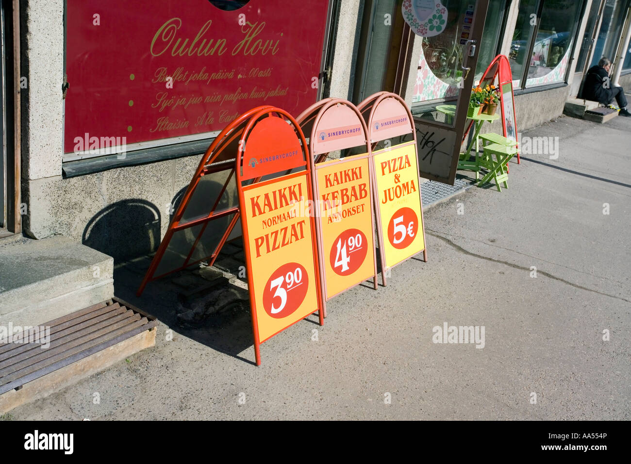 Fast food restaurant signs on pavement, Oulu Finland Stock Photo - Alamy