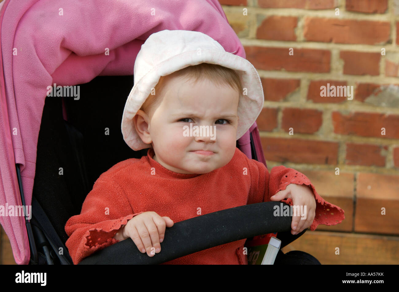 Grumpy child pulling a face Stock Photo