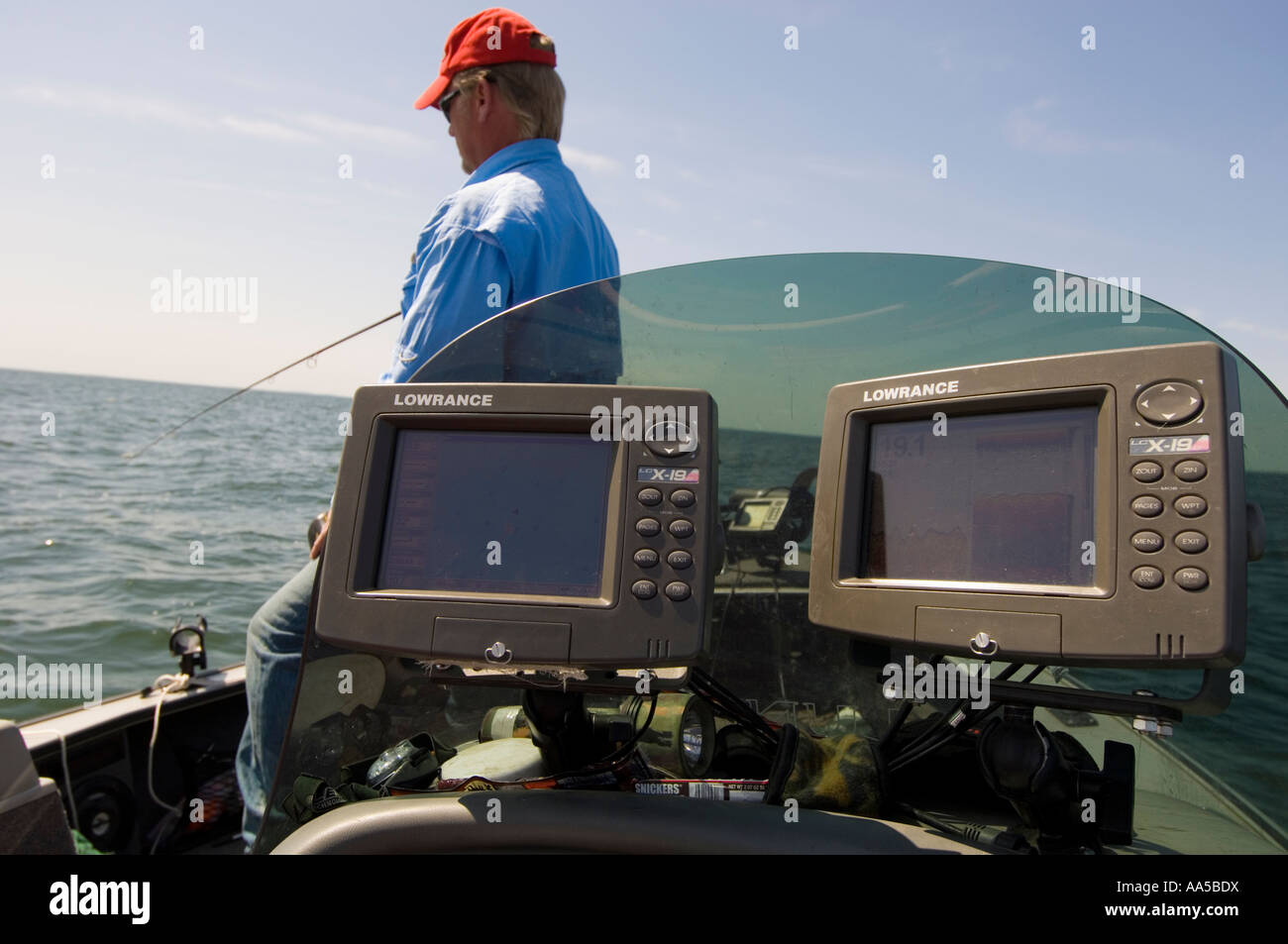 TWO LOWRANCE LC X 19 GPS AND DEPTH FINDER SIT IN THE FOREGROUND AS
