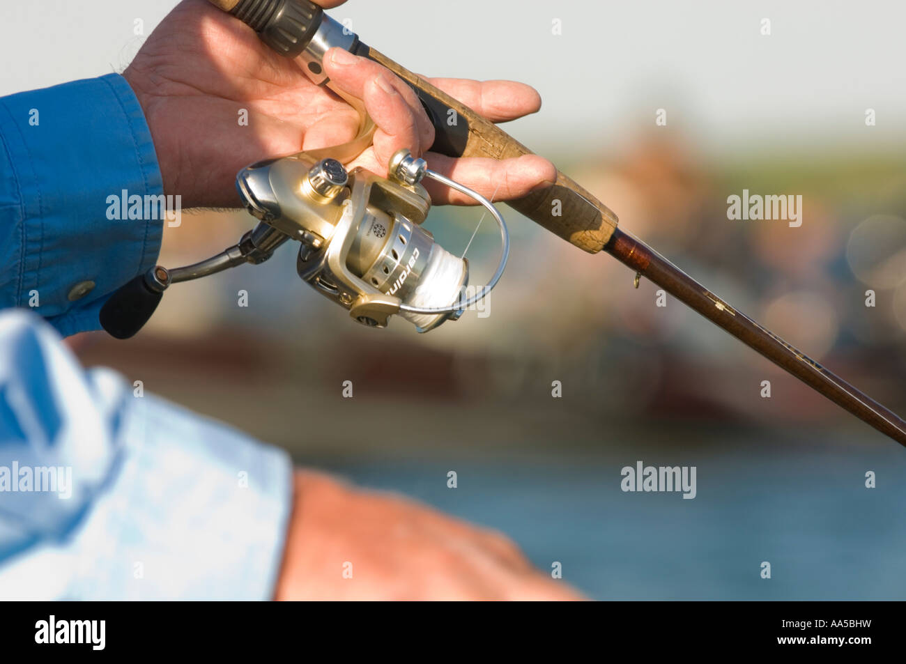 Angler holds abu garcia fishing hi-res stock photography and