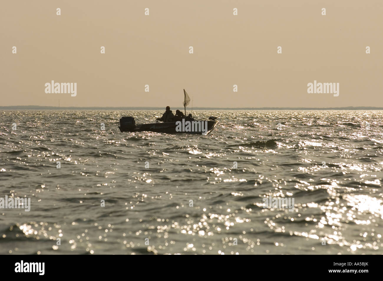 A SILHOUETTE OF A FISHING BOAT ON LAKE MILLE LACS NORTH CENTRAL ...
