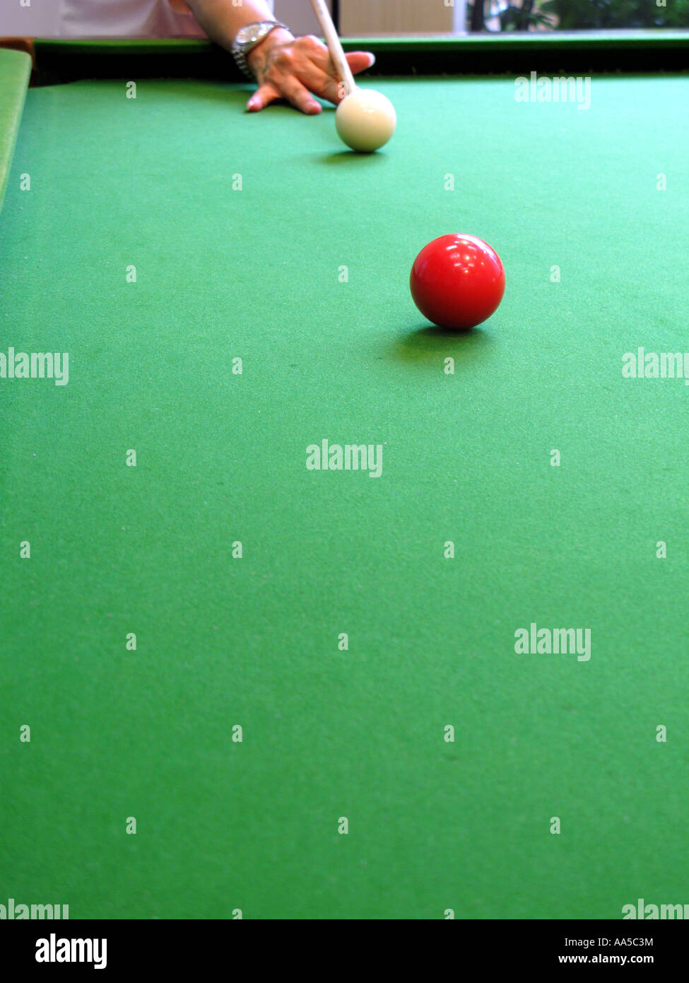 Player target at the red ball on a snooker table Stock Photo Alamy