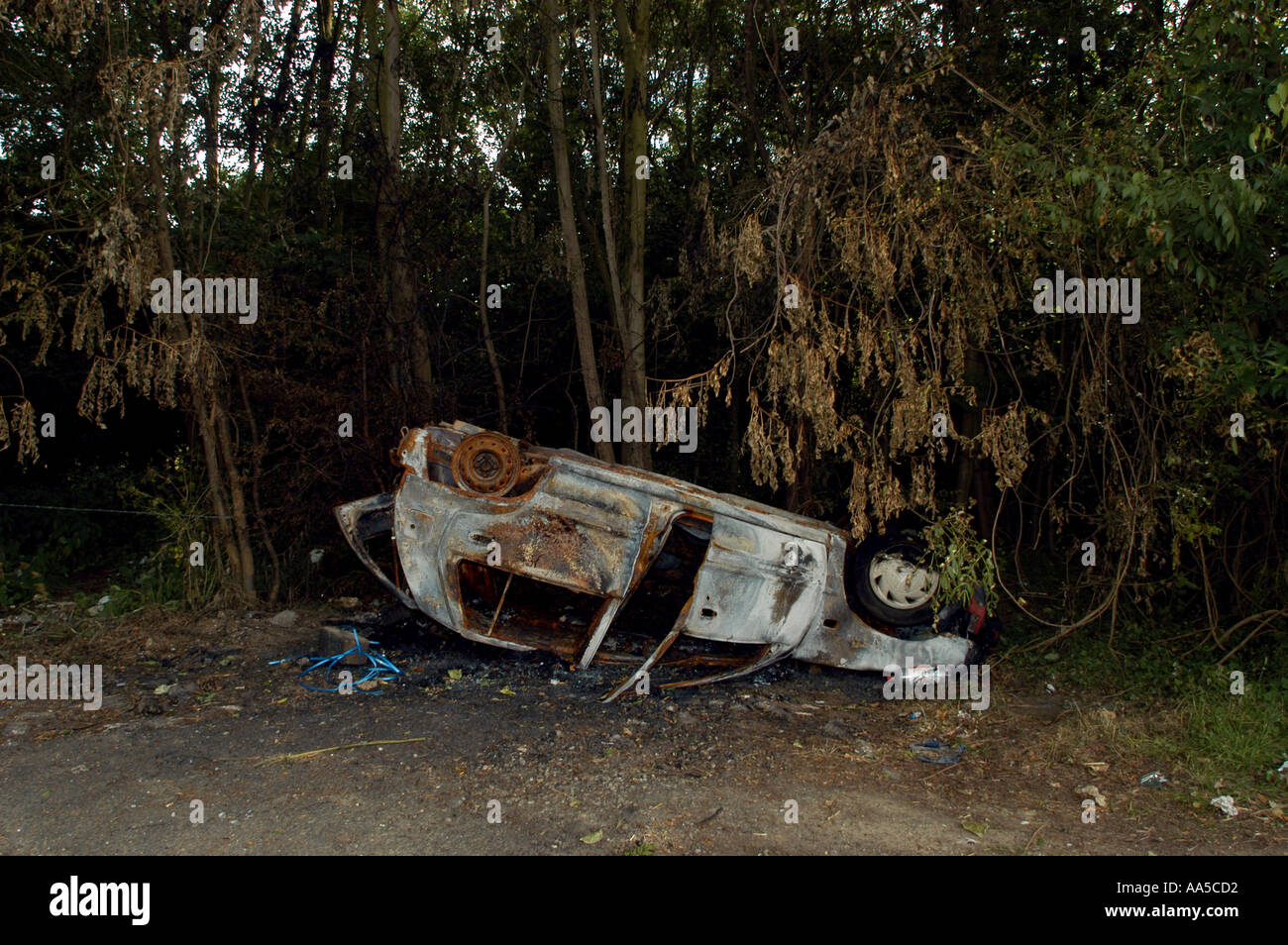 CAR WRECK LEFT BY SIDE OF ROAD JUNCTION OF B1078 AND A140 IN SUFFOLK ENGLAND COPYRIGHT PHOTOGRAPH BY BRIAN HARRIS Stock Photo