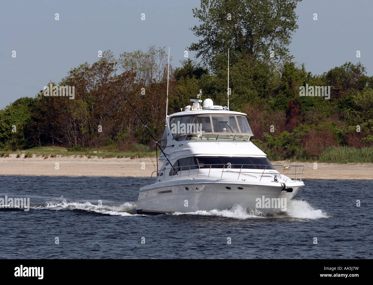 A large cabin cruiser on the Manasquan River Stock Photo Alamy