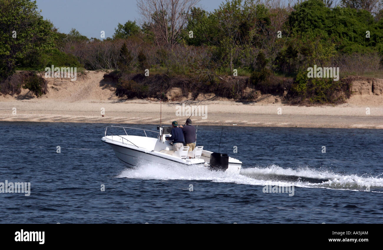 Two fisherman in an open boat speeding down the river Stock Photo - Alamy