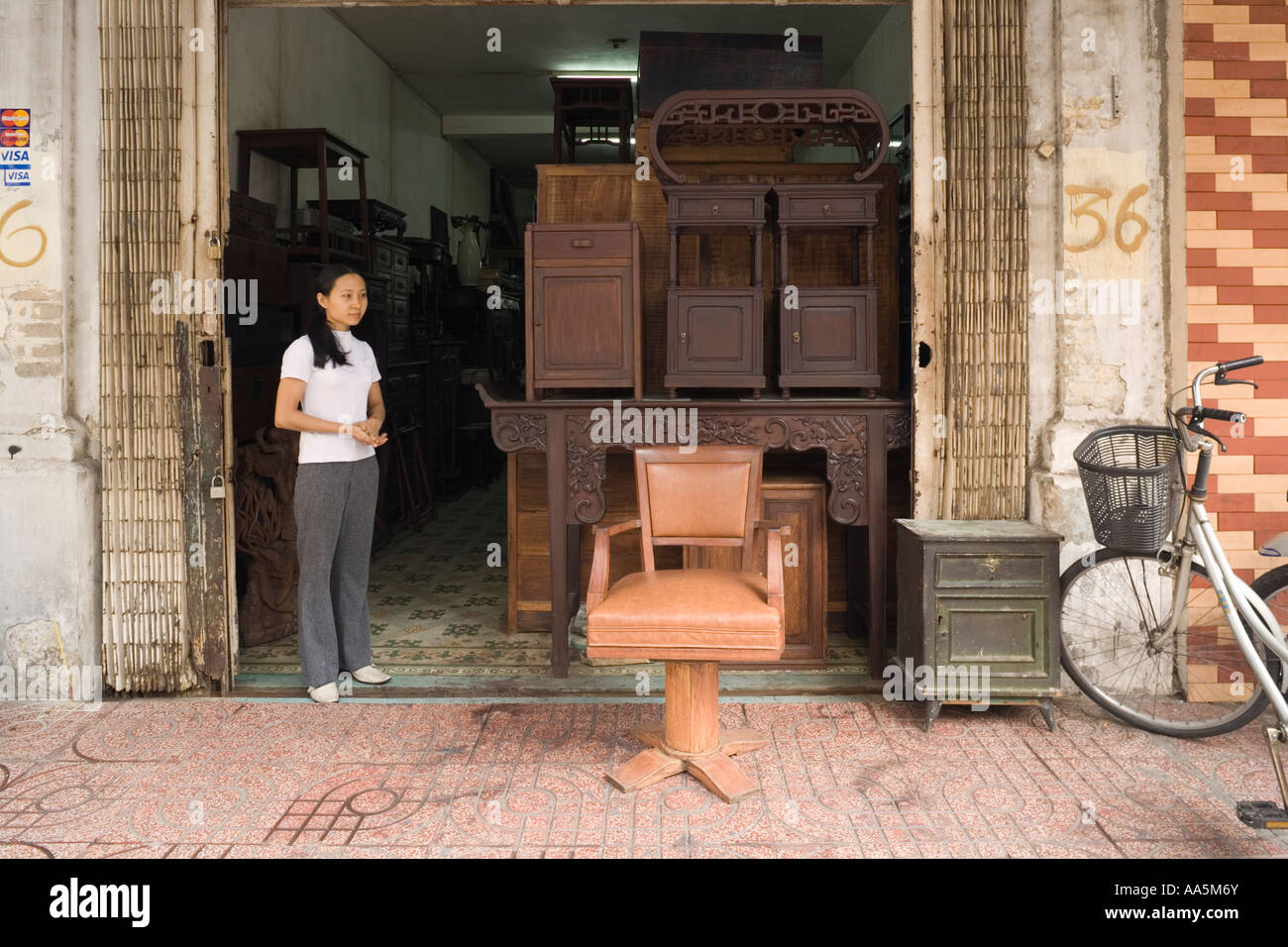 VIETNAM HO CHI MINH CITY SAIGON Antique furniture dealer at Le Cong Kieu Street Stock Photo
