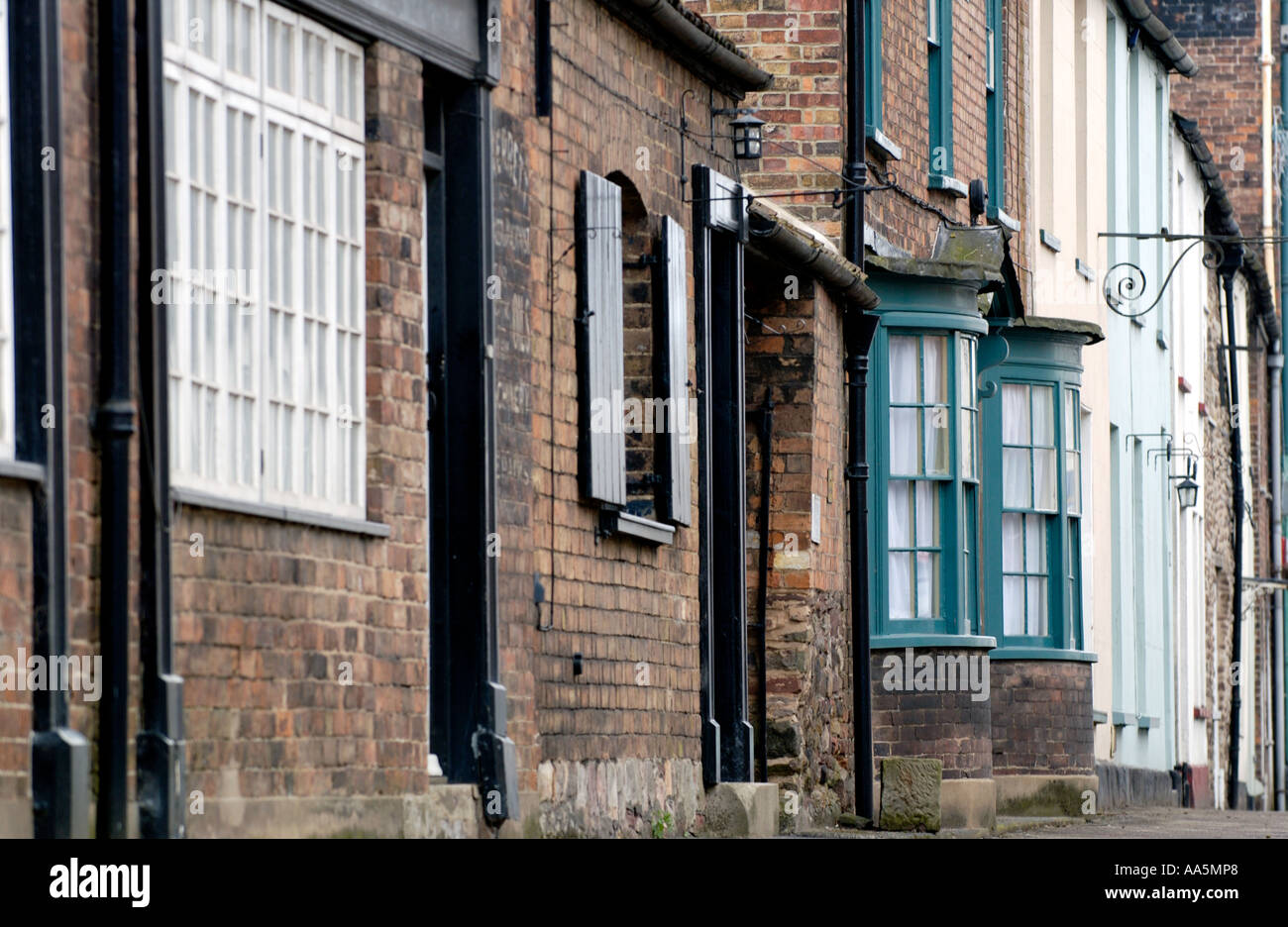 Street of terraced period houses at Berkeley Gloucestershire England UK