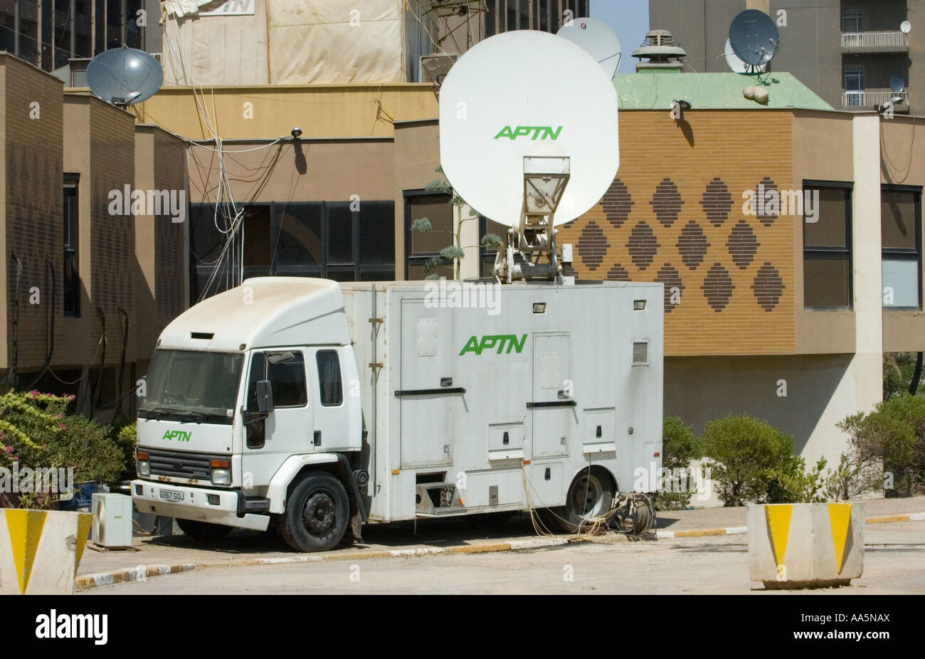 Large satellite uplink truck parked at the 'palestine hotel' in baghdad