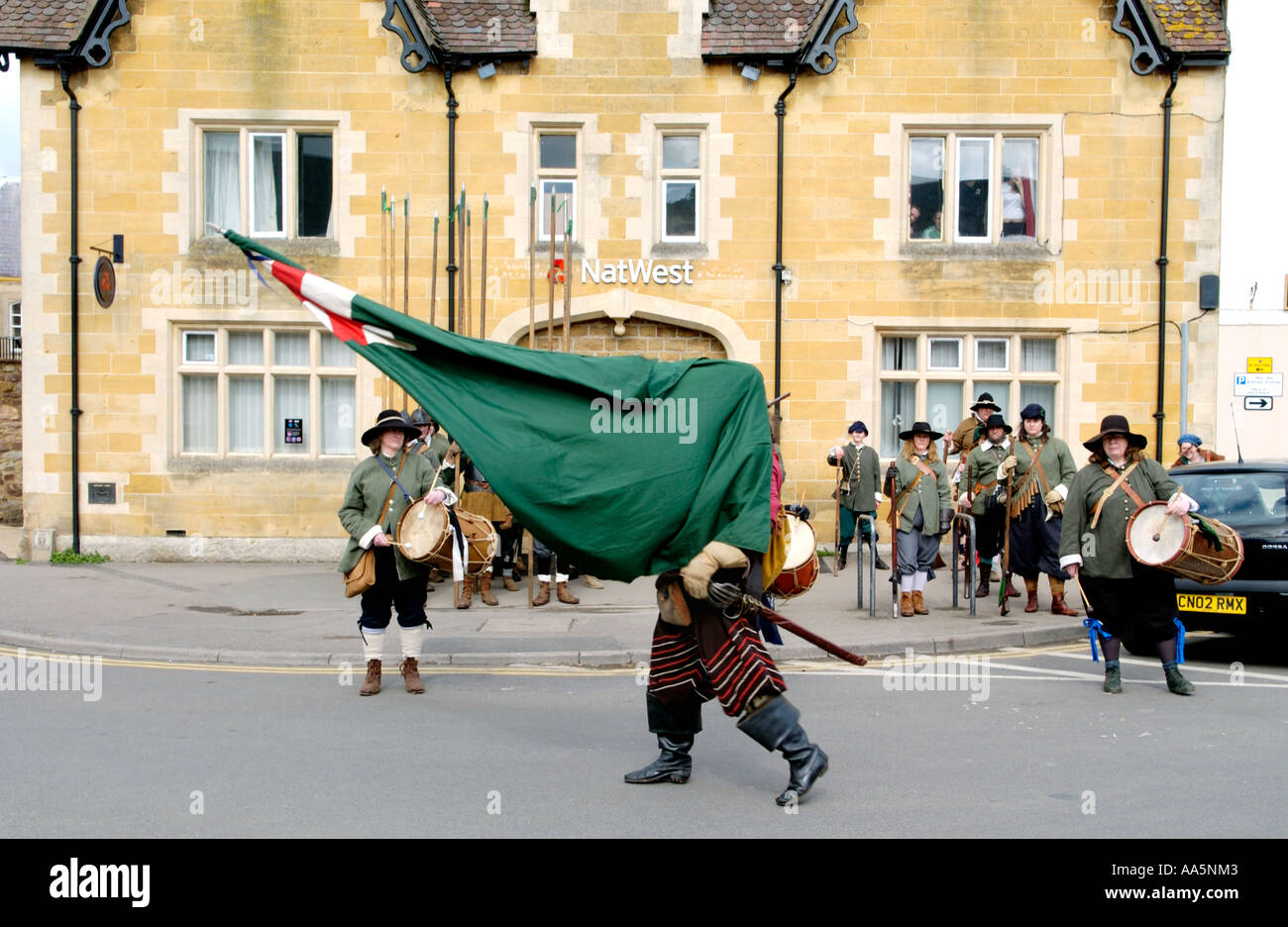 Members of English civil war Sealed Knot Society assemble outside NatWest Bank Berkeley Gloucestershire England UK Stock Photo