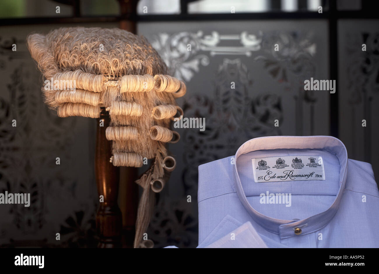 Legal wig and blue shirt in original Victorian window of professional mens and womens clothing shop, Chancery Lane, London Stock Photo