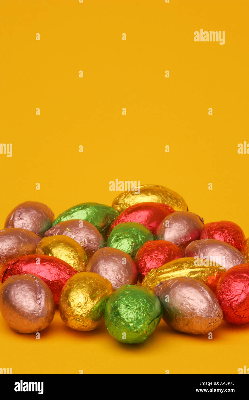 Bright vibrant colourful mini chocolate Easter eggs in foil wrappers on ...