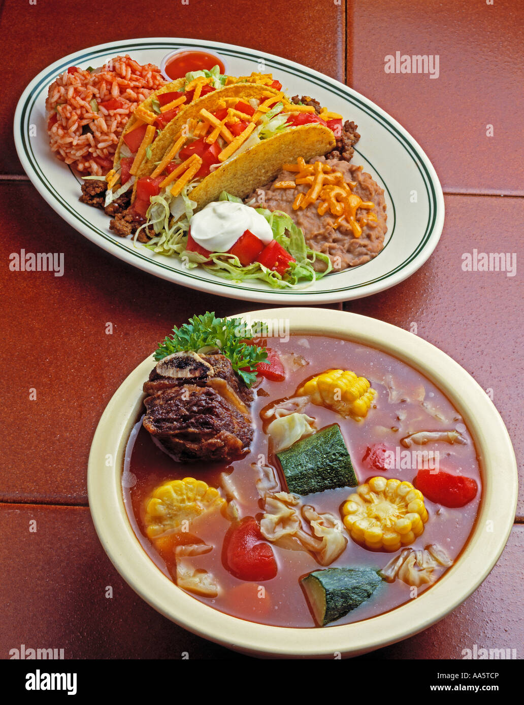 soup beef vegetable corn cob two hard shell tacos refried beans rice