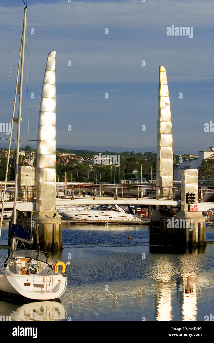 The silvery towers of the bridge mark the boundary of the inner harbour This is the new bridge of a £21m regeration scheme Stock Photo