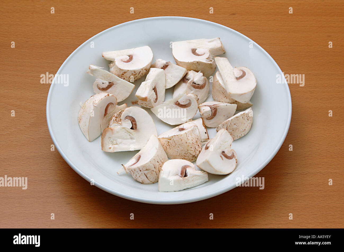 ANG103756 Vegetable white button mushroom shape chopped mushroom in the plate Stock Photo