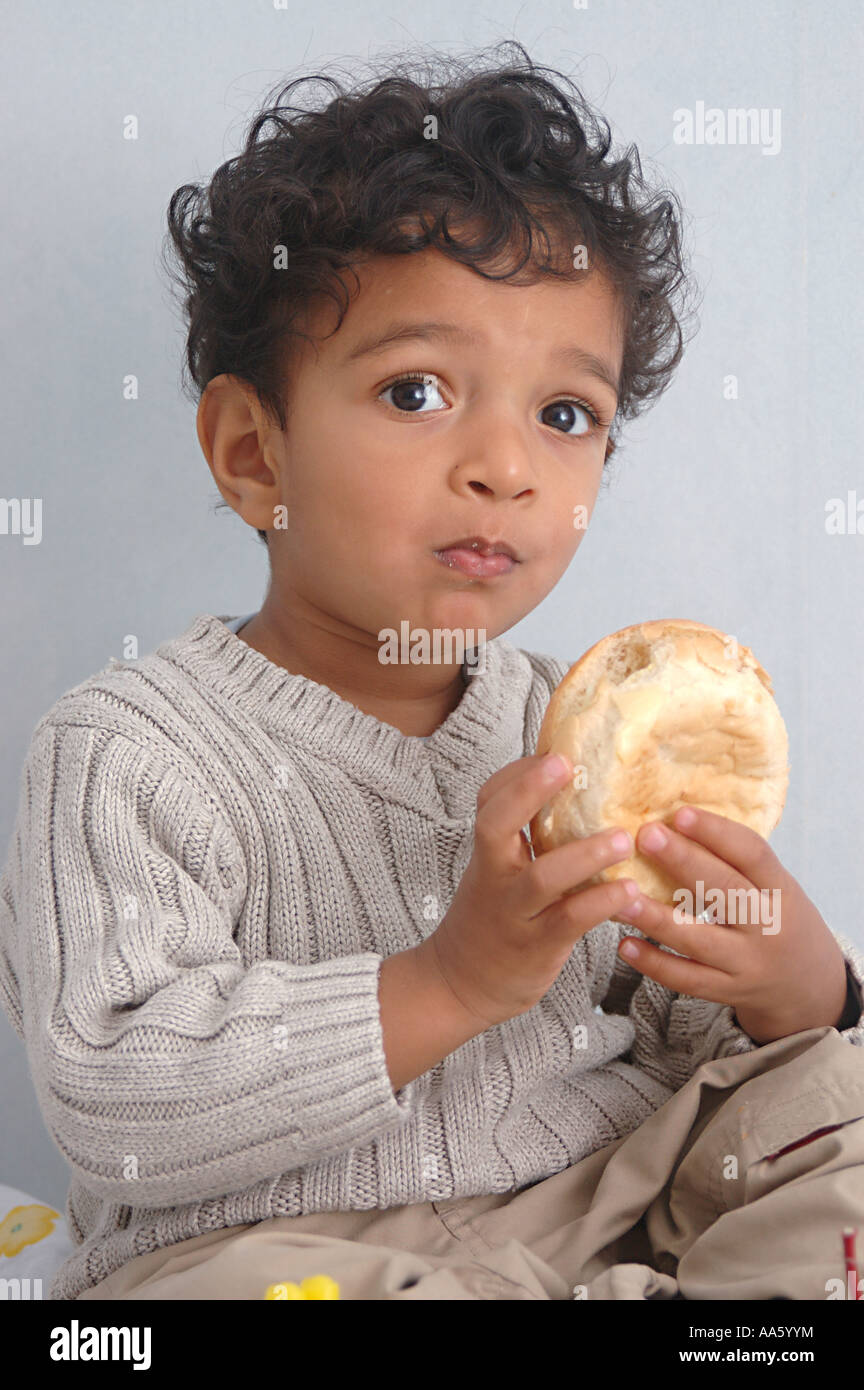 boy eating cheese sandwich Stock Photo Alamy