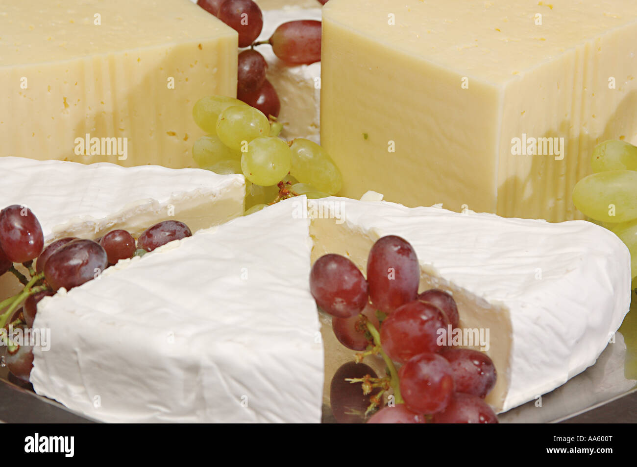 Brie French cheese edamer cheese yellow platter with grapes dessert