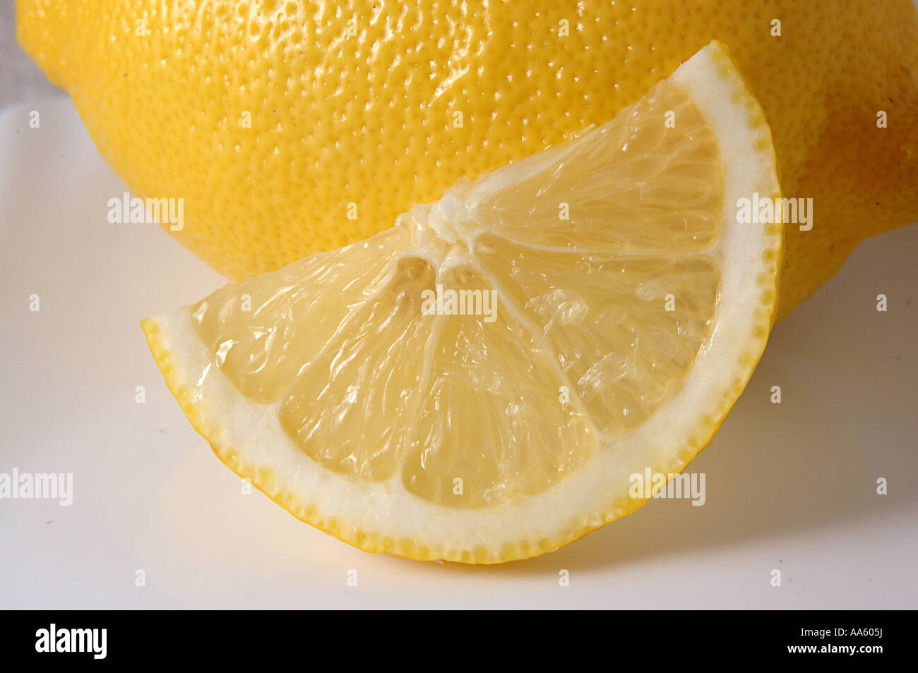 ANG103826 Fruit One lemon and slice on the plate Stock Photo