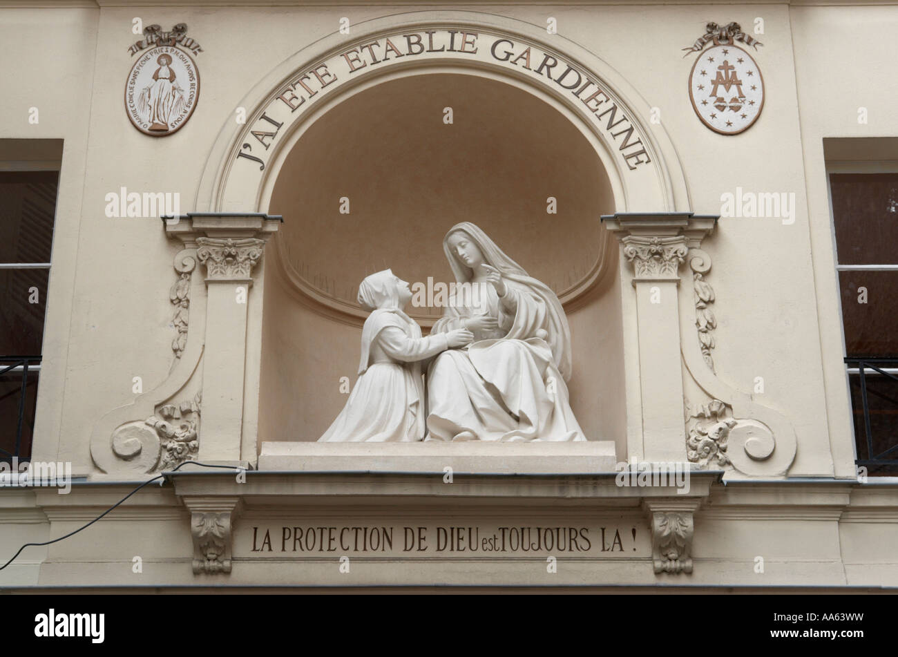 Statue of St Catherine and the Virgin Mary outside the Chapelle Notre Dame de la Medaille Miraculeuse Paris France Stock Photo