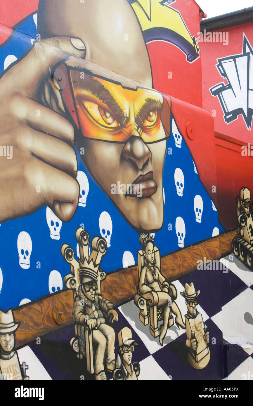 Urban graffiti art spray painted on the end of a house wall in the