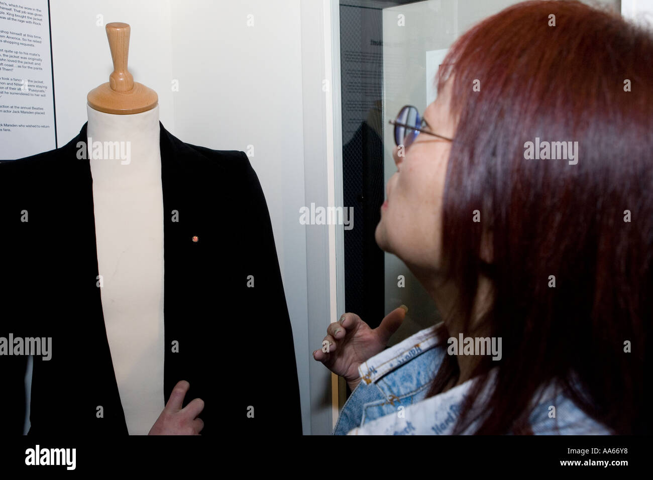 May Pang looking at John Lennons Jacket Stock Photo
