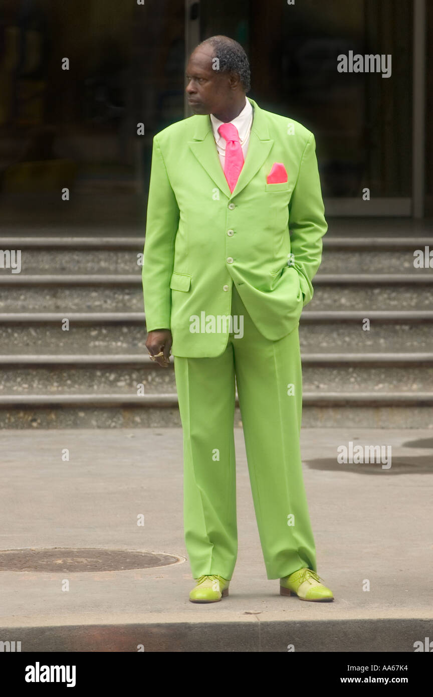 Black man in bright green suit on sidewalk Stock Photo - Alamy
