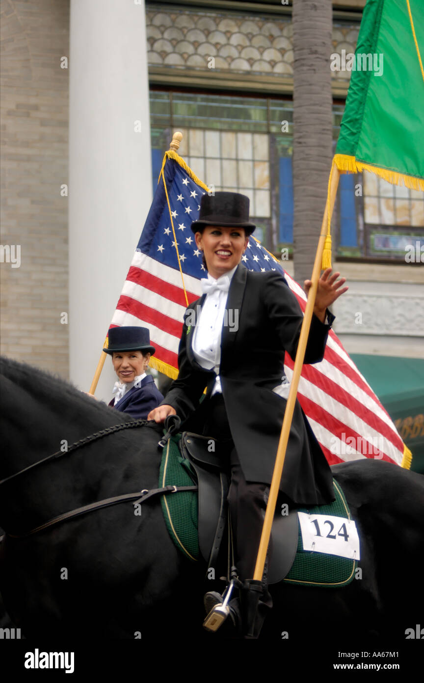 Women riding horseback with flags in Saint Patricks Day Parade in San