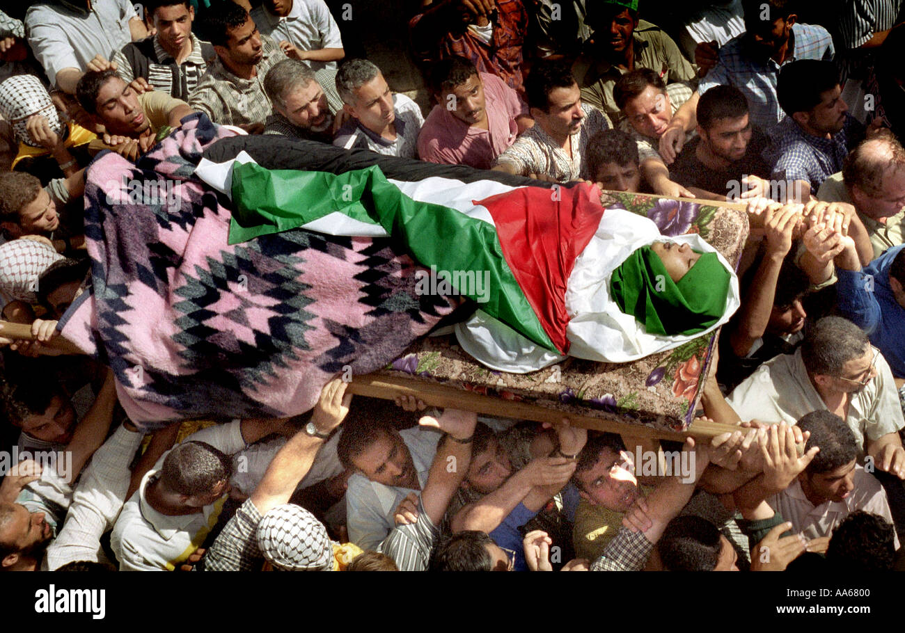 Yusuf Khalifa 18 is carried out of a mosque in Gaza Monday October 9 2000 Tensions are running high between the Palestinians Stock Photo