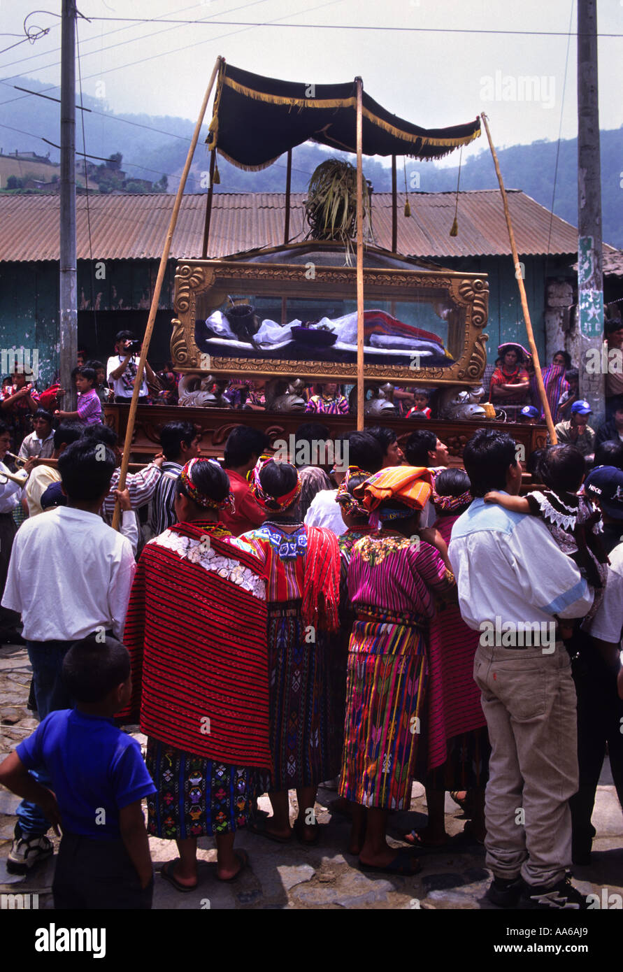 QUICHE VILLAGERS WATCH A RELIGOUS PROCESSION AT SEMANA SANTA CELEBRATIONS IN ZUNIL GUATEMALA Stock Photo