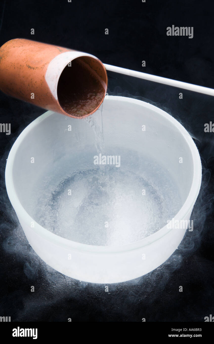 liquid nitrogen being poured into glass bowl Stock Photo Alamy
