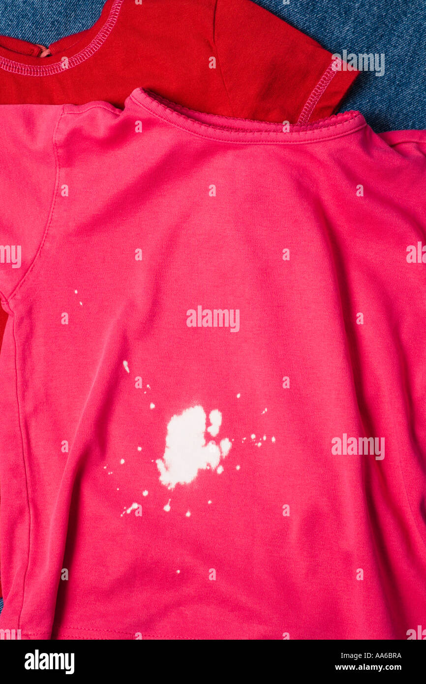 bleach stain on girls pink shirt Stock Photo - Alamy