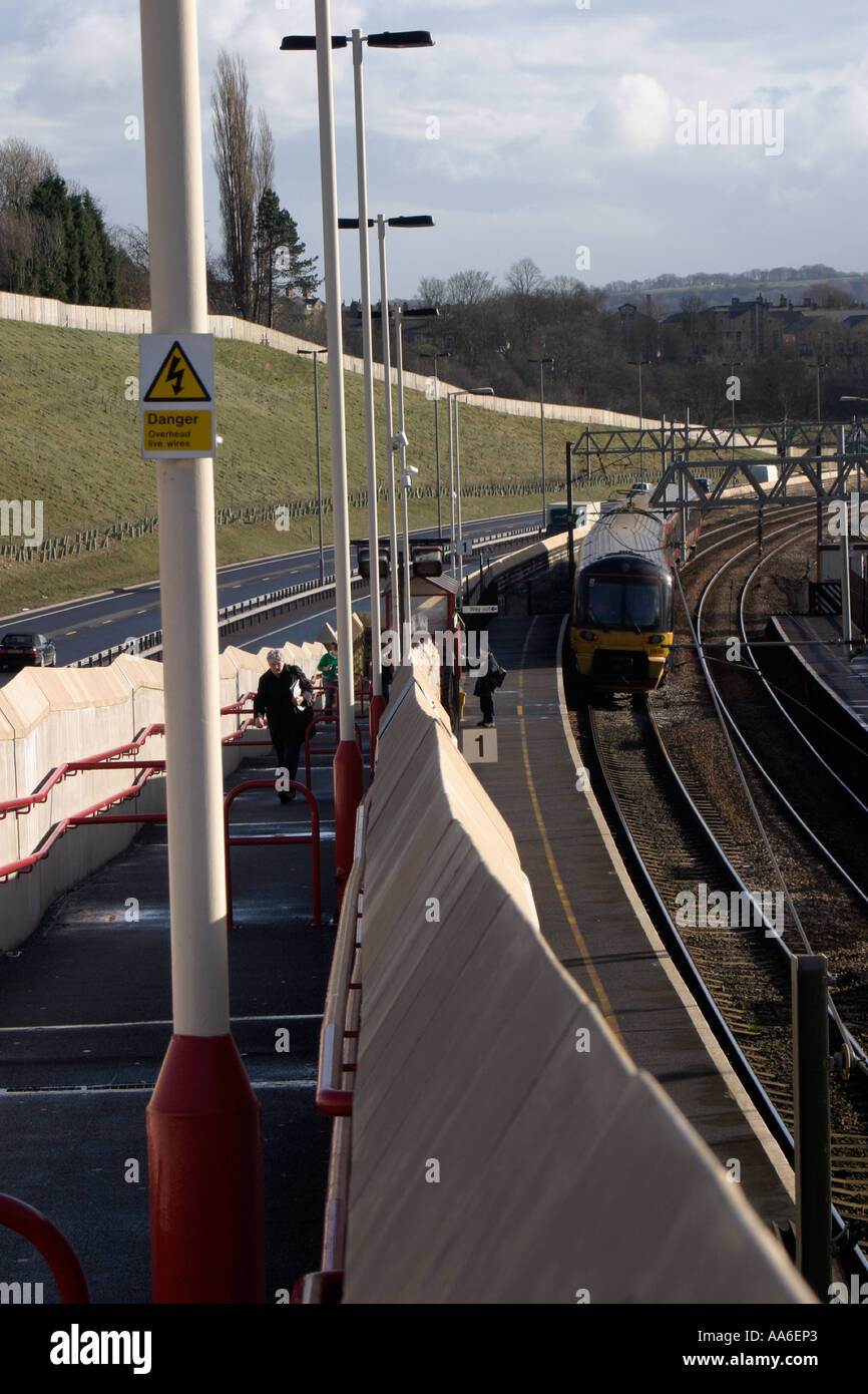 Approach to Crossflatts station with Bingley Aire Valley Relief Road in background Stock Photo