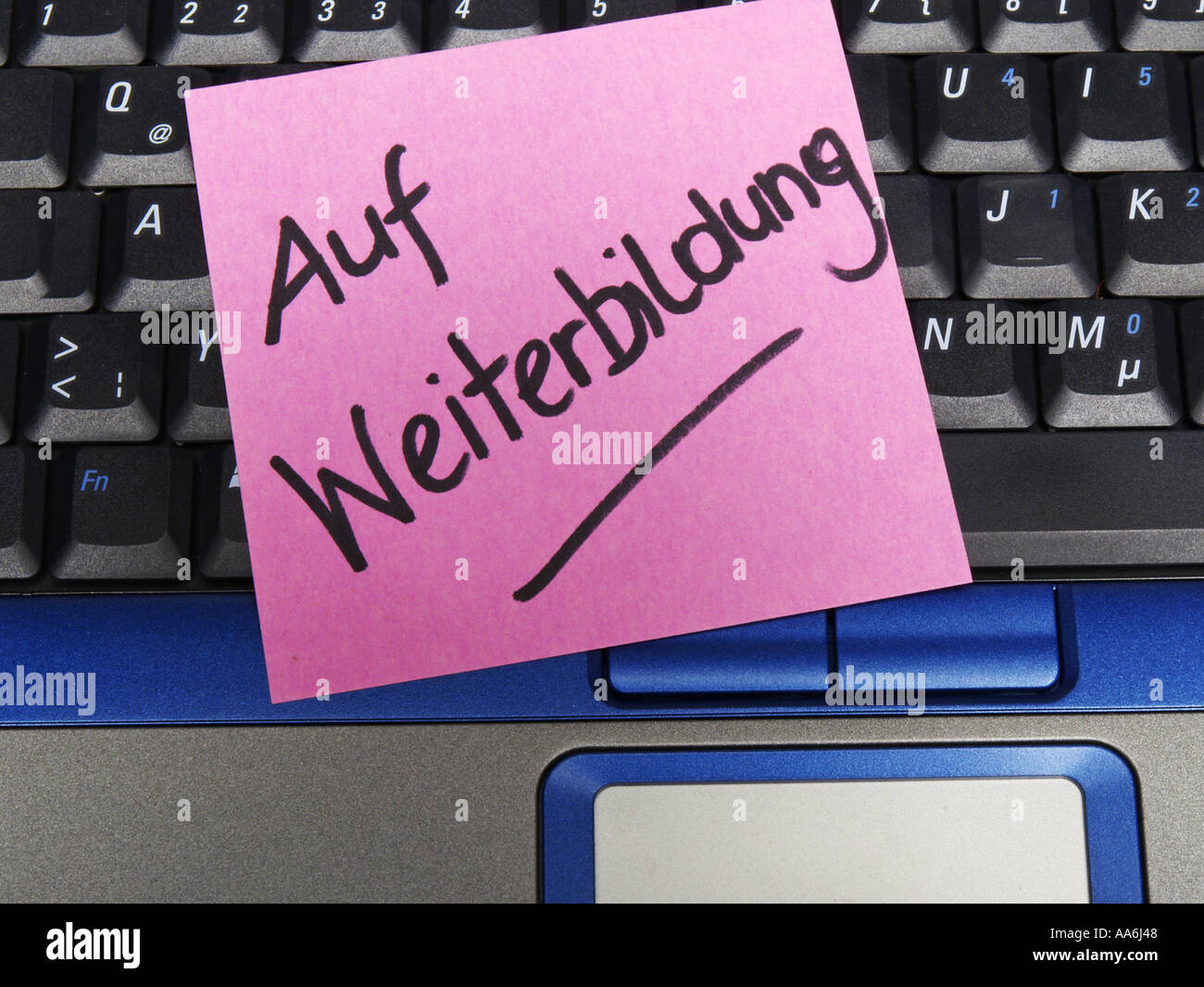 memo note on notebook, on further education Stock Photo