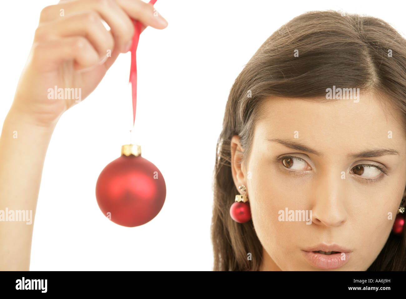 Young woman holding holiday ornament Stock Photo